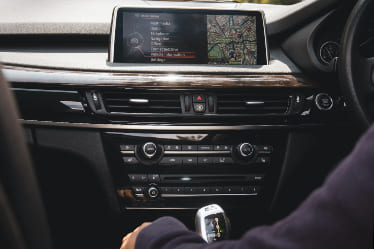Interior photo of a black car dashboard.