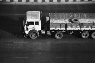 A truck driving down a highway.