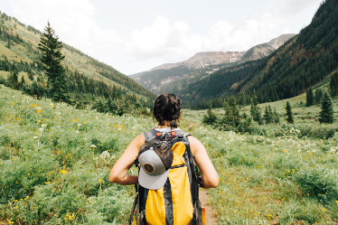 Image of a person hiking with a backpack.